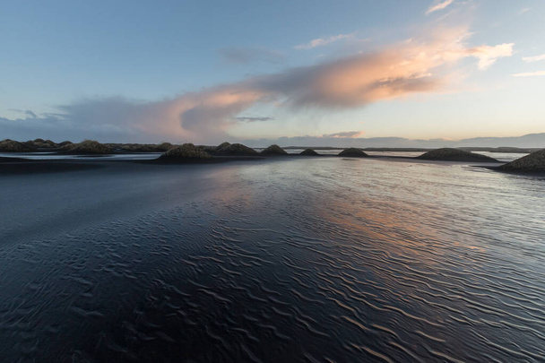 Iceland, Vestrahorn mount and black sand over the ocean. - Foto, imagen