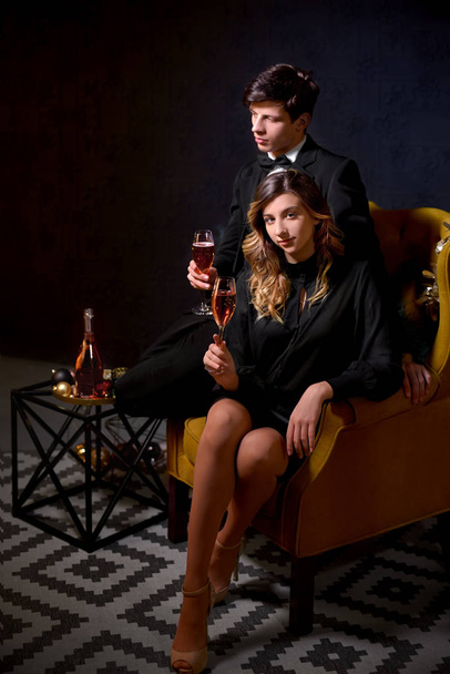 Elegant, luxury couple drinking champagne at a party. - Фото, зображення