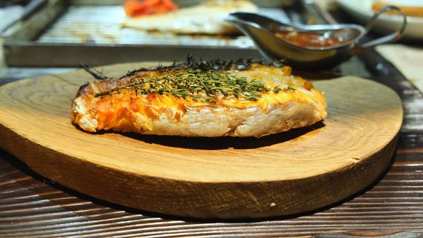 Grilled fish, grilled salmon steak with the addition of aromatic spices, close-up, 4k. Grilled seafood. - Photo, Image