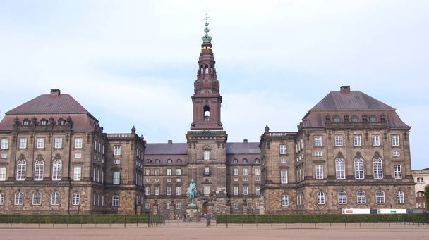 COPENHAGEN, DENMARK - JUL 05th, 2015: Christiansborg palace, famous landmark of danish capital. Christiansborg castle, the seat of parliament on Slotsholmen - Fotó, kép