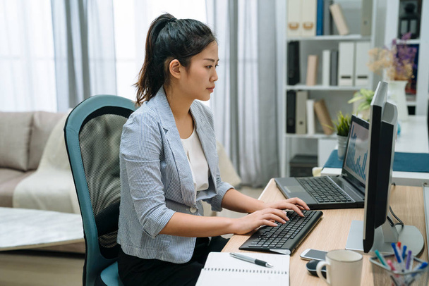 korean girl working at home on computer - Fotó, kép