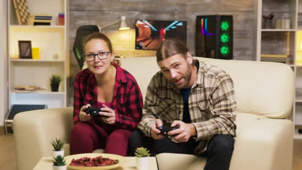 Young couple disappointed after losing at online video games - Video, Çekim