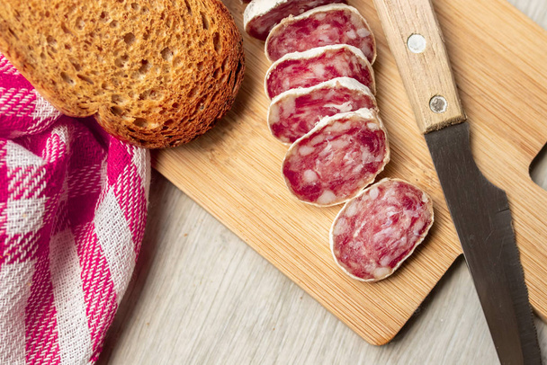 meat sausages on wooden table top view - Foto, imagen