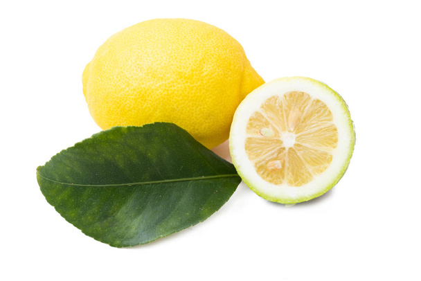 natural lemons with lemon leaves isolated on white - Photo, Image