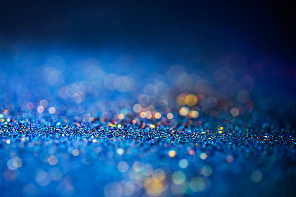 Shiny multicolor glitter raster background. Abstract shimmering pink, blue, yellow circles decorative backdrop. Bokeh lights effect illustration. Overlapping glowing and twinkling spots. - Photo, Image