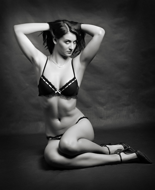 Studio shot young beautiful women dressed in black and white lingerie. - Photo, Image