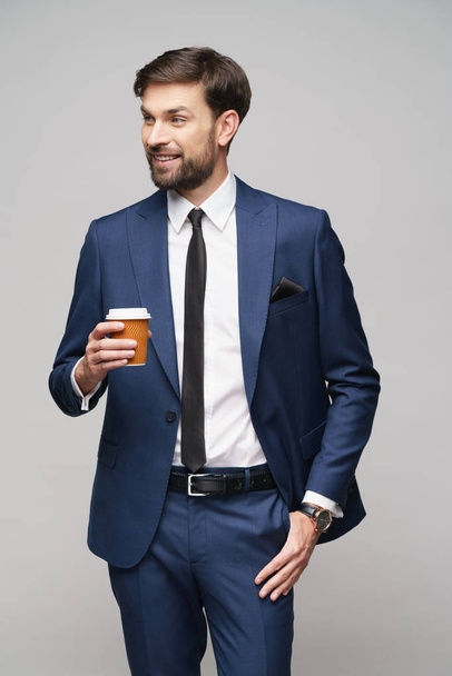 Young caucasian Businessman holding takeout paper cup coffee - Φωτογραφία, εικόνα