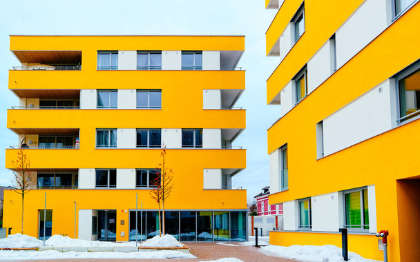 Yellow Modern residential apartment and flat building exterior in Salzburg reflex - Photo, Image
