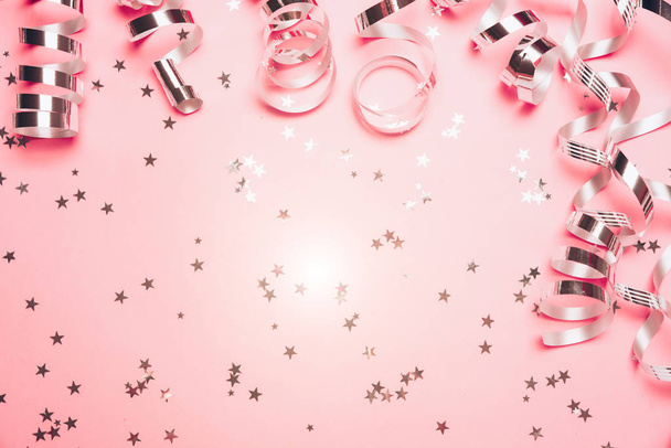 Pink confetti and stars and sparkles on pink background. - Zdjęcie, obraz