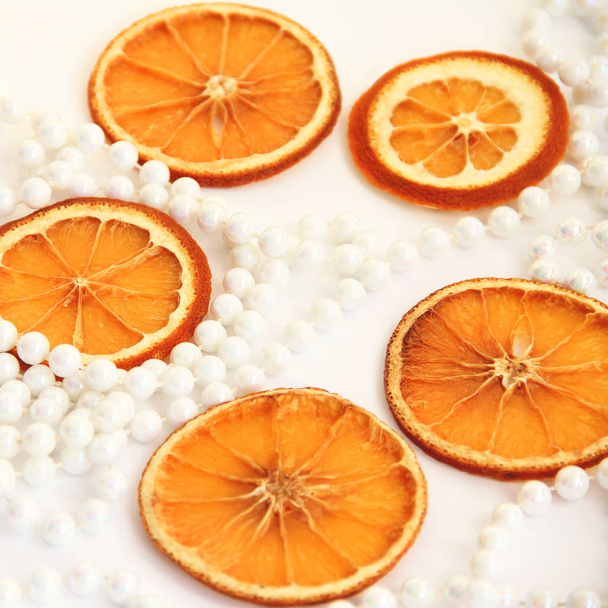 Christmas decorations with orange on a white background. Festive background - Fotografie, Obrázek