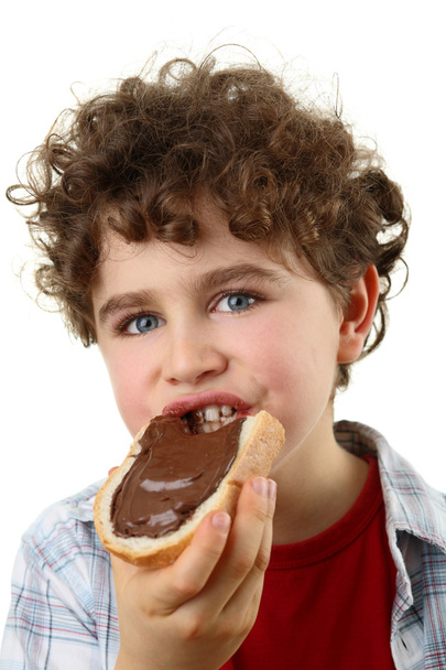 Kid eating bread with nut butter - Photo, image