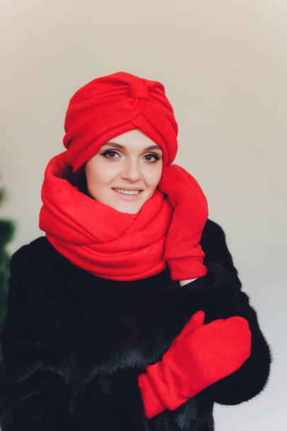 Photo of self assured Arabian lady in hijab, shows you right way, points at blank space with both fore fingers, invites going there, promots copy space. Check it out with me. - Fotografie, Obrázek