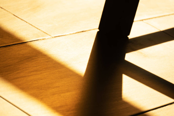 sunlight and shadow of table on the floor interior abstract back - Photo, image