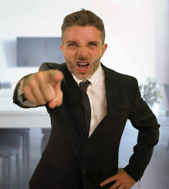 business work lifestyle portrait of stressed and angry businessman screaming furious scolding very upset and unhappy as company boss in problems and stress concept - Photo, image