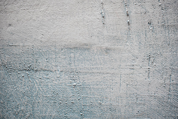 Ruwweg gepleisterde grijze muur. Achtergronden en texturen - Foto, afbeelding