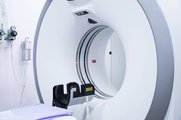 Close up of CT scanner with Red laser beam for adjust position.  - Foto, afbeelding