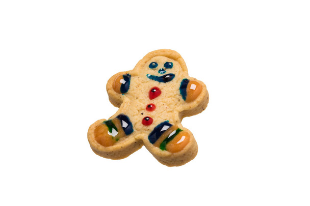 gingerbread cookie in the form of a decorated little man isolated on a white background - Fotoğraf, Görsel