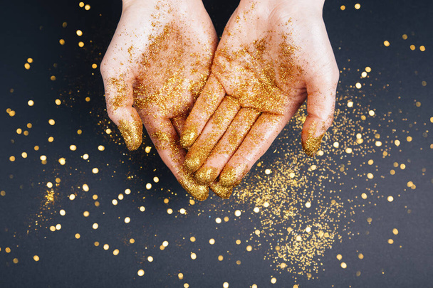 Beautiful man's hands in golden - Foto, imagen