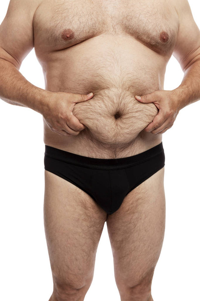 Fat man with a big belly. Side view. Isolated over white background.  - Φωτογραφία, εικόνα