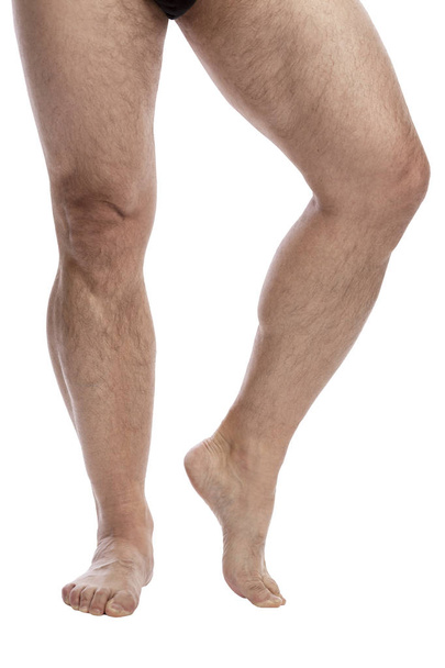 Men's legs. Isolated over white background.  - Zdjęcie, obraz