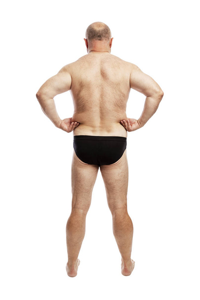 Fat man in shorts. Back view. Full height. Isolated over white background. - Foto, Imagem