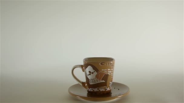 pouring coffee beans in mug - Felvétel, videó