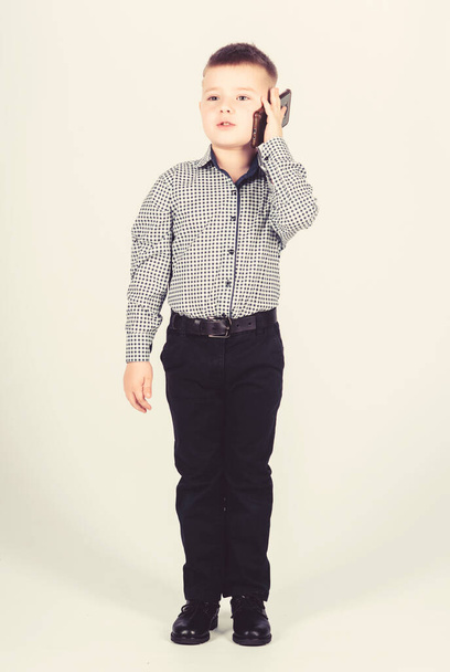 Businessman. Office life. Conversation. little boss. Ceo direstor. childhood. Business communication. confident child has business start up. Modern life. small boy with mobile phone. Successful kid - Foto, immagini
