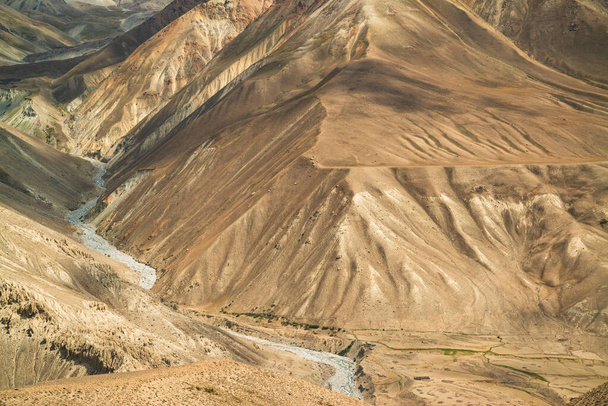 View on Wakhan Corridor in Afghanistan behind the Wakhan river. Taken from Pamir highway on Tajikistan side. - 写真・画像