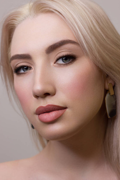 Beauty Fashion woman lips with natural Makeup and beige Nail polish Matte lipstick and nails.Beauty girl face close up.Nude Colors.Sexy lips, Manicure, Make up,glowing skin,touching face,autumn,lovely - Фото, зображення