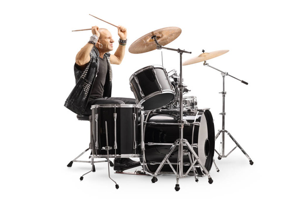 Male drummer in a leather vest performing - Foto, imagen