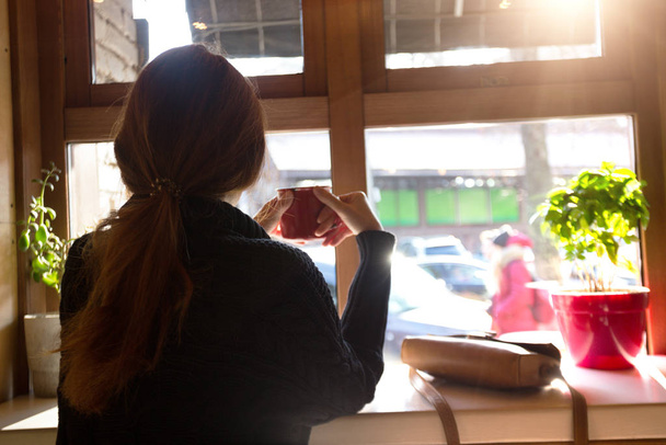 girl sitting with  cup of coffee  - 写真・画像
