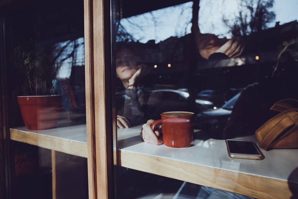 girl sitting with  cup of coffee  - Fotoğraf, Görsel