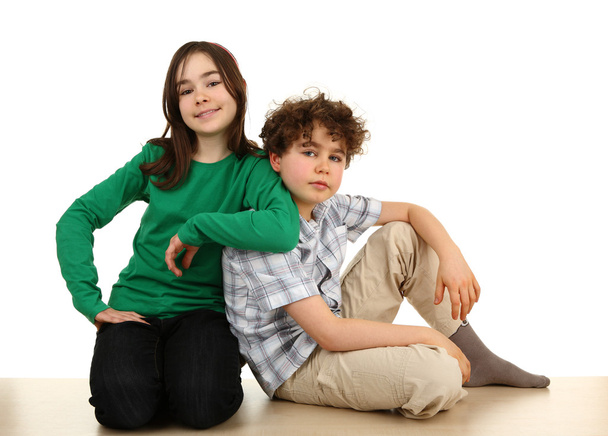 Girl and boy sitting - Фото, зображення