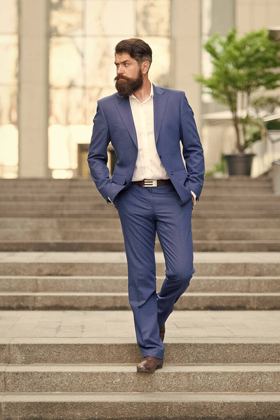 Business man in modern city. Beginning of working day. Motivated for success. Office worker confidently step on stairs. Founder successful business. Conquer business world. Bearded man going to work - Φωτογραφία, εικόνα