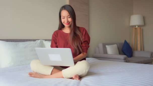 footage of Asian woman working with laptop at home - Video