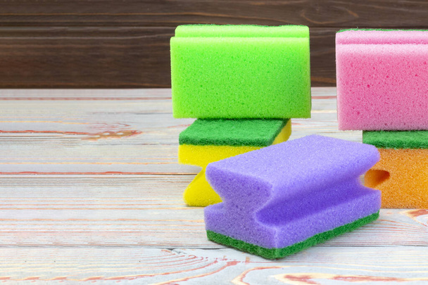 sponges for washing dishes. on a wooden background in retro style. close-up. - Фото, изображение