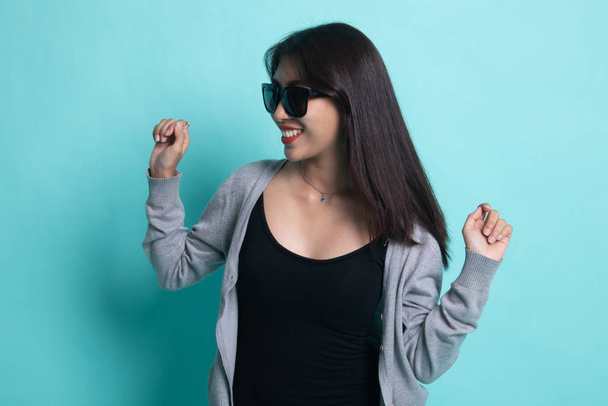 Portrait of a beautiful young asian girl in sunglasses. - Photo, Image
