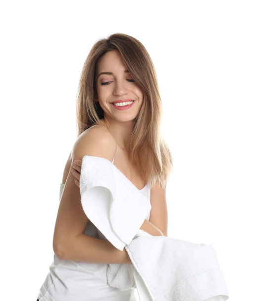 Young woman wiping body with towel on white background - Zdjęcie, obraz
