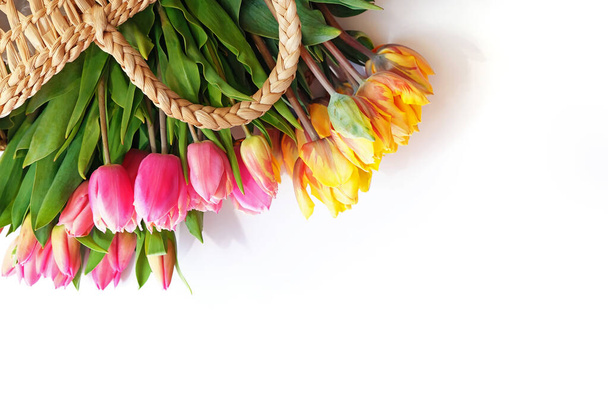 Bunch of fresh colorful spring tulips in the basket - Fotoğraf, Görsel