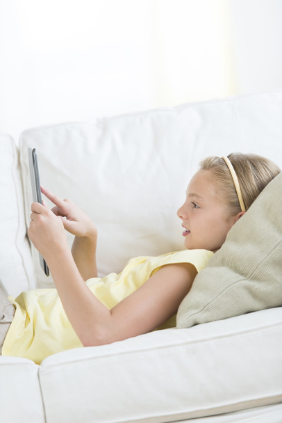 Girl Using Digital Tablet At Home - Fotó, kép