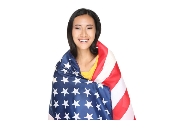 Young woman wrapped in American flag isolated on white backgroun - Фото, зображення