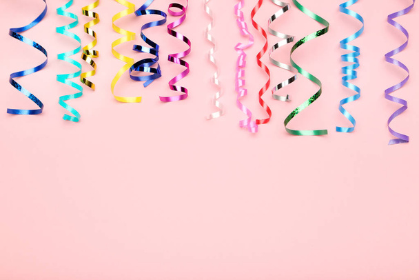 Colorful ribbons on pink background - Zdjęcie, obraz