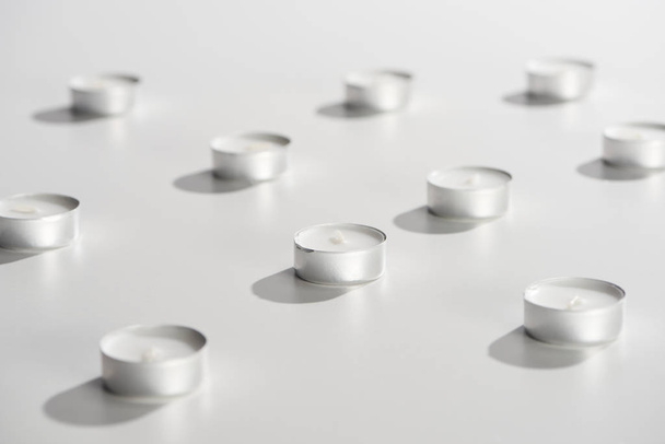 selective focus of candles on white surface - Fotó, kép