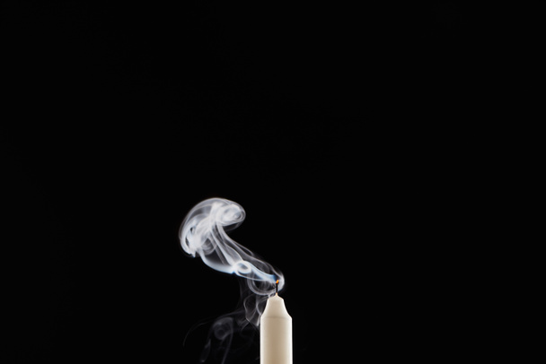 extinct white candle with smoke on black background - Foto, imagen