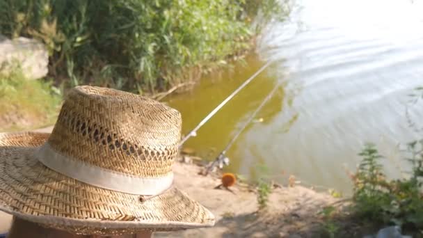 Fisherman looks at the distance of the water basin and waits for the fish to catch - Footage, Video