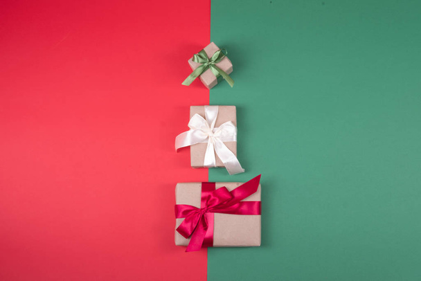 Beautiful packaging of presents with satin ribbons and craft paper. - Фото, зображення