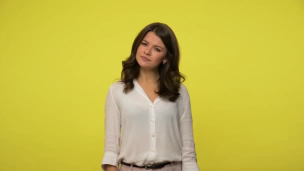 Eureka! Inspired happy woman with brunette hair in blouse raising finger and rejoicing at solution found, amazed about sudden insight, got excellent idea. studio shot isolated on yellow background - Video