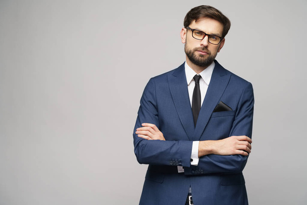 studio photo of young handsome businessman wearing suit - Fotografie, Obrázek