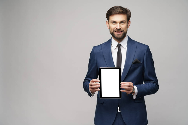 Young Businessman presenting digital tablet pc pad with blank screen - Foto, Imagem