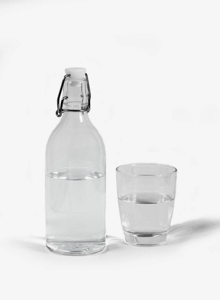 Bottle of water and a glass - Фото, изображение